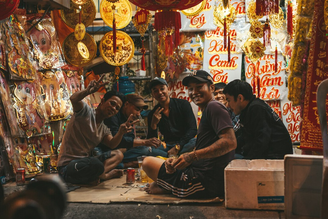 Group of friends talking and laughing around a table